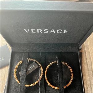 Authentic Versace earrings never worn with authentication certification